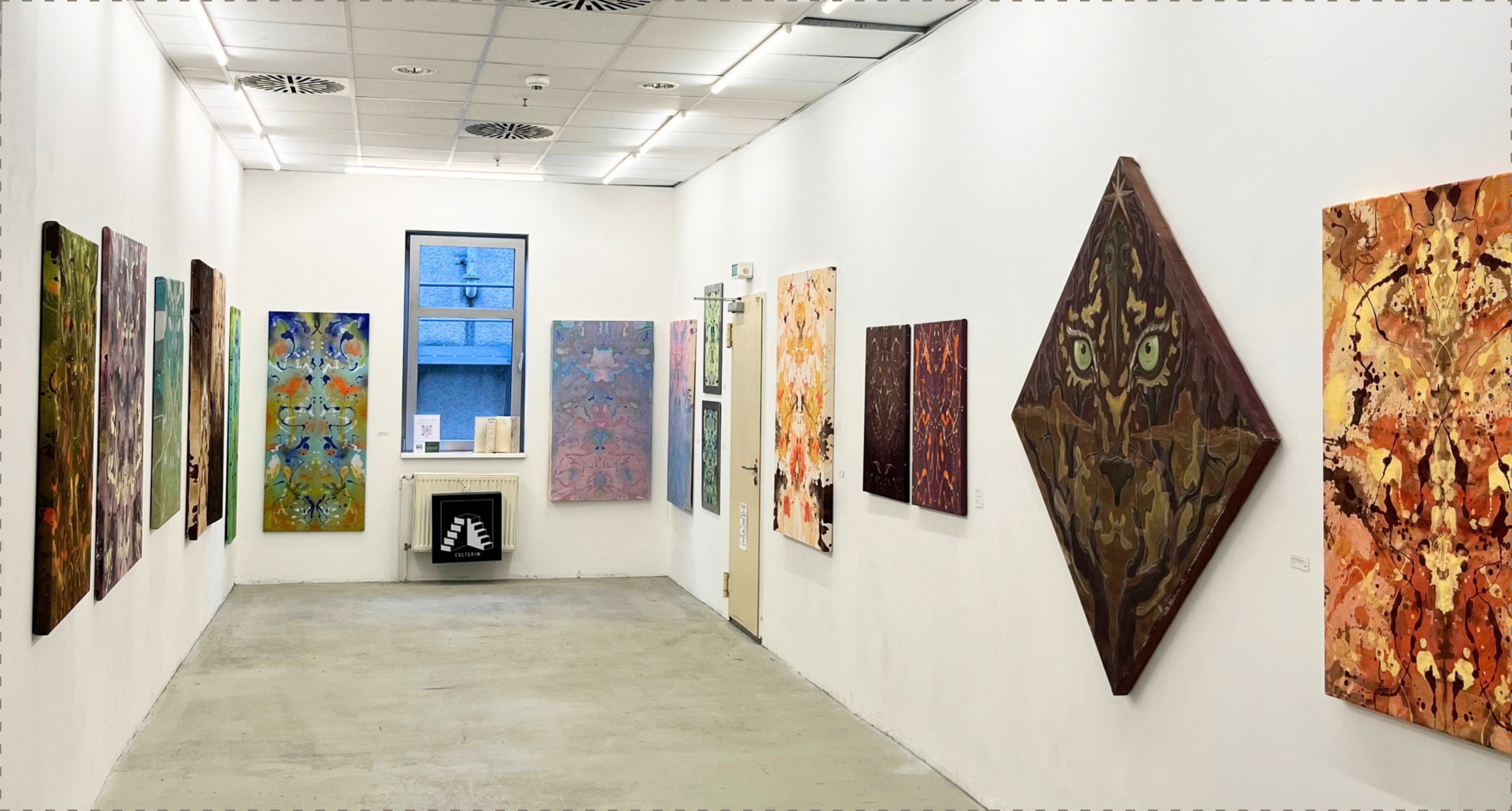 Livia Dualis paintings displayed in the exhibition gallery