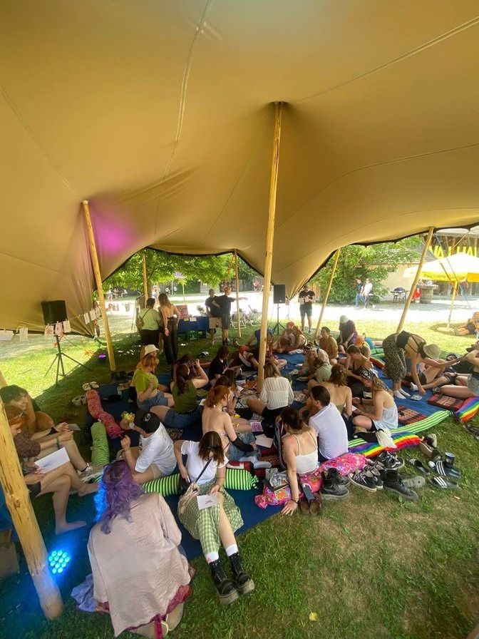 Participants seated together in an outdoor workshop circle